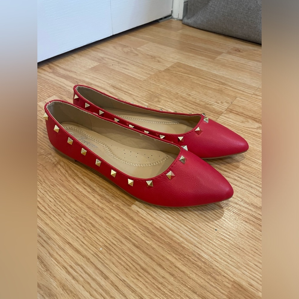 red pointy flats with studs
